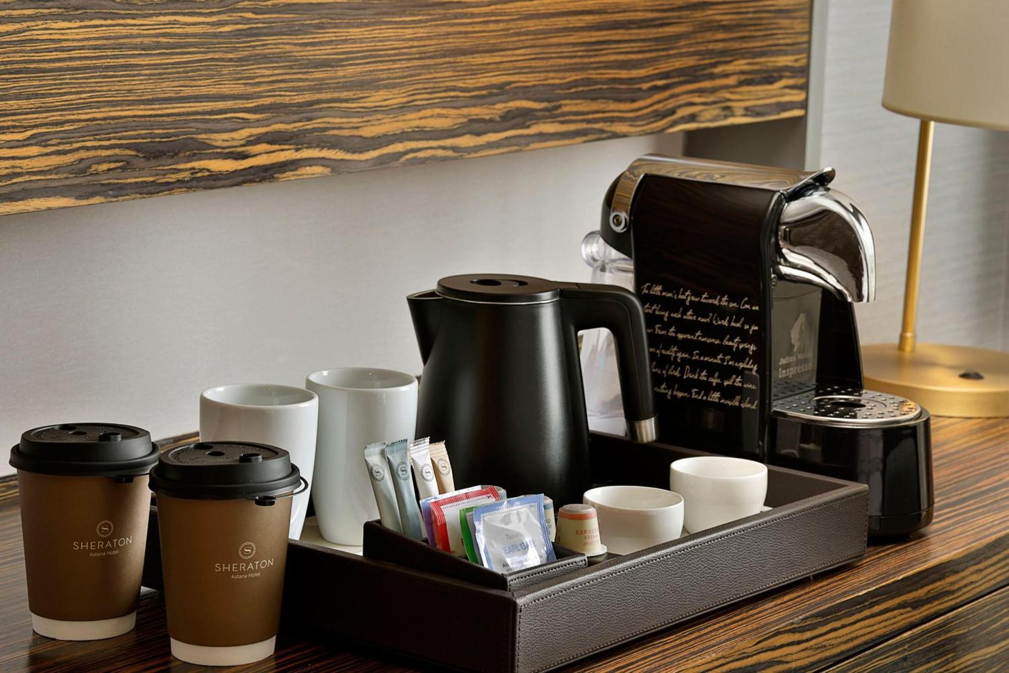 Sheraton Astana Hotel Bagian luar foto A Nespresso coffee machine in a hotel room