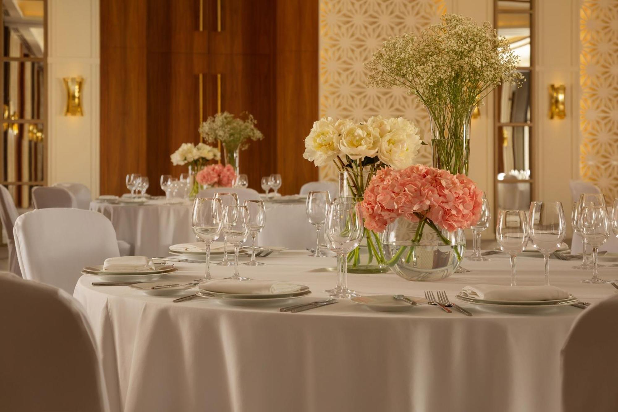 Sheraton Astana Hotel Bagian luar foto A table set for a formal dinner